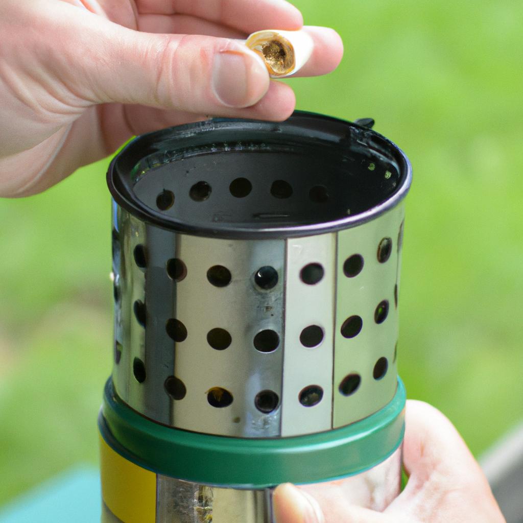 Preparing the bee smoker with pellets for use.